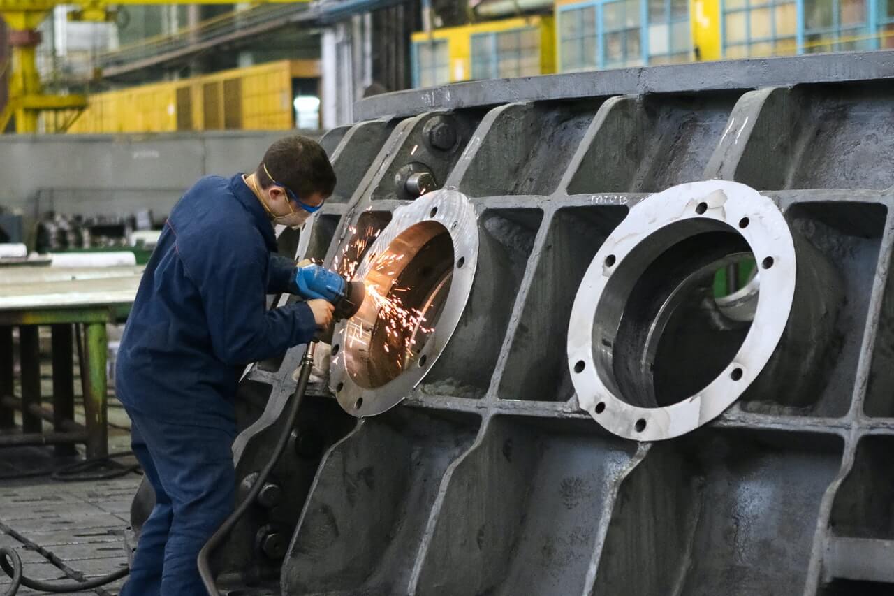 A man working on an industrial machine.